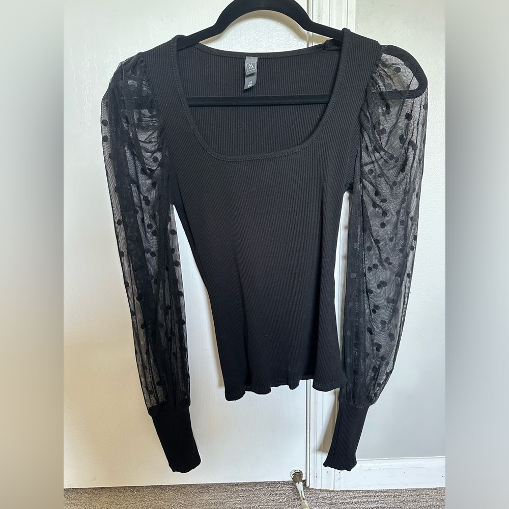Black sweater with mesh sleeves and poka dots